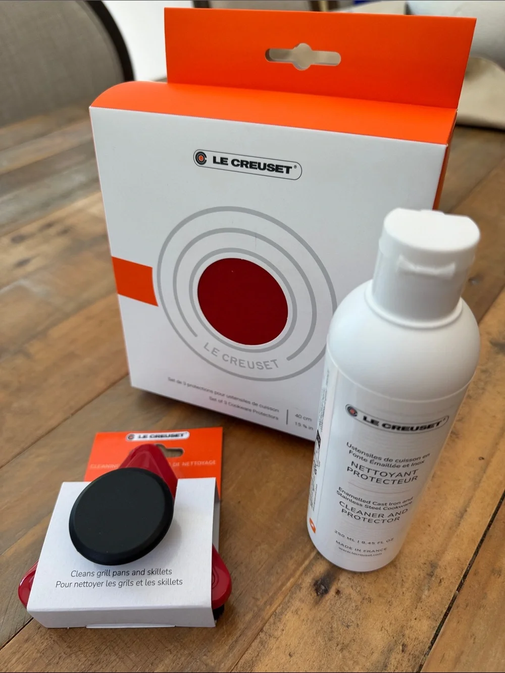 Le Creuset cleaning brush, three cookware protectors, 8 oz cleaner & protector